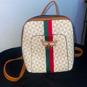 Brown, white and silver with red and green stripes backbag for women